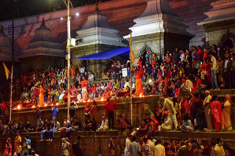 Devotees attending Ganga Aarti and chanting Shiv Tandav Strotam at Pashupatinath Temple, Kathmandu